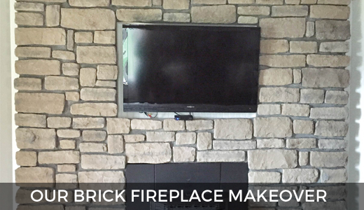 Brick fireplace makeover | Stone veneer fireplace | Stone veneer over brick | Stone fireplace with TV mounted | GinaKirk.com @ginaekirk